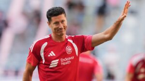 Chicago Fire's Robert Lewandowski waves as the team warms up before an MLS soccer match against Inter Miami, Wednesday, July 22, 2026, in Miami. (AP Photo/Lynne Sladky)