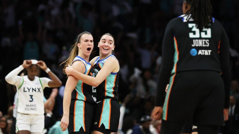 New York Liberty guard Sabrina Ionescu, left, reacts with teammates Pauline Astier, center, and Jonquel Jones (35) after scoring a three-point basket during the first half of Game 2 of a WNBA basketball first-round playoff series against the Minnesota Lynx, Tuesday, Sept. 29, 2026, in New York. (Heather Khalifa/AP)