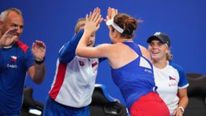 Czech Republic's Linda Noskova , centre right, and Czech Republic's Karolina Muchova high five after they won their women's singles semifinal matches against Spain's Cristina Bucsa and Spain's Jessica Bouzas Maneiro, respectively, in Shenzhen, China, Friday, Sept. 25, 2026. (Andy Wong/AP)