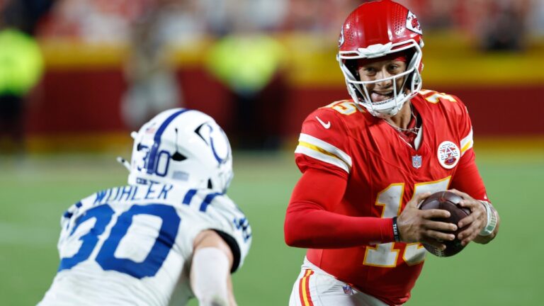 Kansas City Chiefs quarterback Patrick Mahomes (15) runs for a first down as Indianapolis Colts safety Hunter Wohler (30) defends during overtime of an NFL football game Sunday, Sept. 20, 2026, in Kansas City, Mo. (AP Photo/Colin E. Braley)