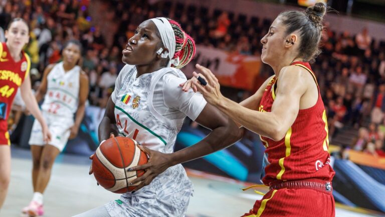 Mali's Maimouna Haidara, left vies for the ball with Spain's Maria Conde during the women's World Cup basketball match between Mali and Spain, in Berlin, Saturday, Sept. 5, 2026. (Andreas Gora/dpa via AP)
