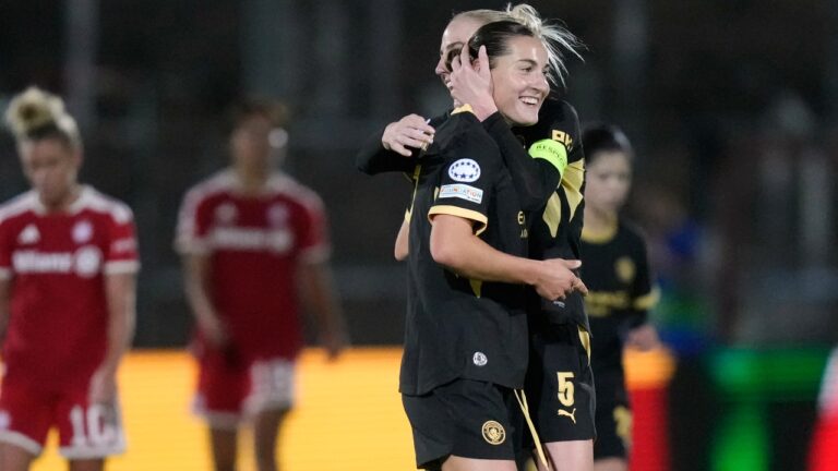 Manchester City's Carlotta Wamser celebrates with Alex Greenwood, background, after scoring her side's second goal during the women's Champions League opening phase soccer match between FC Bayern Munich and Manchester City in Munich, Germany, Tuesday, Sept. 22, 2026. (AP Photo/Matthias Schrader)