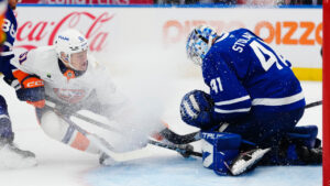 New York Islanders' Emil Heineman (51) scores on Toronto Maple Leafs goaltender Anthony Stolarz (41) during third period NHL hockey action in Toronto on Wednesday, Sept. 30, 2026. (Frank Gunn/CP)