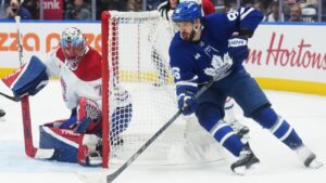 Toronto Maple Leafs' Kirill Marchenko (86) tries a wraparound on Montreal Canadiens goaltender Jakub Dobes (75) during second period NHL hockey action in Toronto on Tuesday, Sept. 29, 2026. (Nathan Denette/CP)