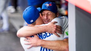 Max Scherzer and George Springer and of the Toronto Blue Jays hug after Scherzer was taken out of the game against the Cincinnati Reds during the eighth inning in their MLB game at Rogers Centre on September 27, 2026 in Toronto, Canada. (Mark Blinch/Getty Images)
