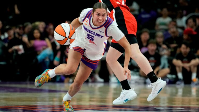Phoenix Mercury guard Shay Ciezki (5) dribbles past Japan guard Kokoro Tanaka (26) during the second half of an exhibition basketball game, Wednesday, April 29, 2026, in Phoenix. (AP Photo/Ross D. Franklin)