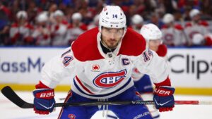 Montreal Canadiens captain Nick Suzuki (14) lines up for a face-off during the second period in Game 1 of a second-round NHL hockey Stanley Cup playoff series against the Buffalo Sabres, Wednesday, May 6, 2026, in Buffalo, N.Y. (Jeffrey T. Barnes/AP)