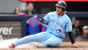Toronto Blue Jays third baseman Kazuma Okamoto (7) slide into home for a run against the Detroit Tigers during fourth inning MLB baseball action in Toronto on Wednesday, Sept. 16, 2026. (Nathan Denette/CP)