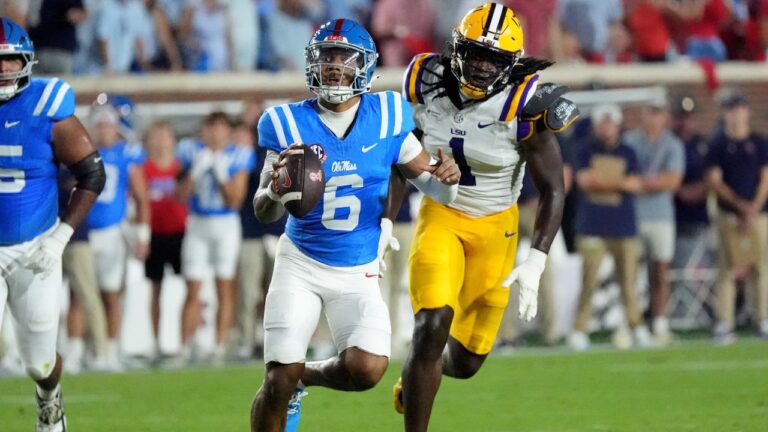 Mississippi quarterback Trinidad Chambliss (6) is pursued by LSU defensive end Princewill Umanmielen (1) during the first half of an NCAA college football game in Oxford, Miss., Saturday, Sept. 19, 2026. (AP Photo/Rogelio V. Solis)