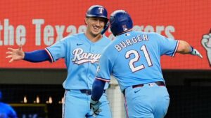 Texas Rangers' Wyatt Langford, left, and Jake Burger (21) celebrate Burger's two-run home run that scored Langford during the fourth inning of a baseball game against the Tampa Bay Rays Sunday, Sept. 6, 2026, in Arlington, Texas. (Tony Gutierrez/AP)