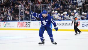 Toronto Maple Leafs defenceman Morgan Rielly (44) celebrates Auston Matthews' game-winning goal against the Buffalo Sabres during during overtime NHL hockey action in Toronto. 2024. (Nathan Denette/CP)