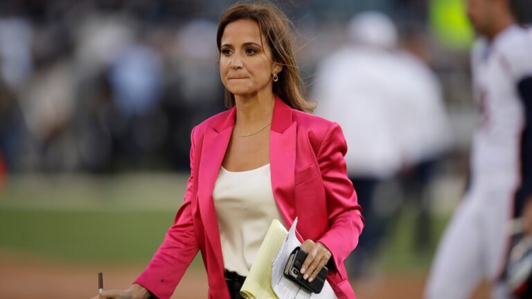 Reporter Dianna Russini works on the sidelines before the start of an NFL football game between the Oakland Raiders and the Denver Broncos Monday, Sept. 9, 2019, in Oakland, Calif. (AP Photo/Ben Margot, File)
