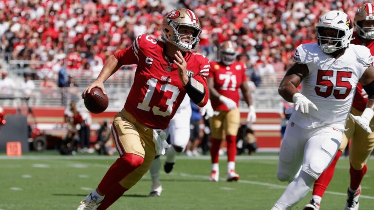 San Francisco 49ers quarterback Brock Purdy (13) runs against Arizona Cardinals defensive tackle Dante Stills (55) during the first half of an NFL football game in Santa Clara, Calif., Sunday, Sept. 27, 2026. (Kelley L. Cox/AP)