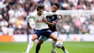 Tottenham Hotspur's Sandro Tonali, left, and Aston Villa's Boubacar Kamara challenge for the ball during the English Premier League soccer match between Tottenham Hotspur and Aston Villa, at Tottenham Hotspur Stadium in London, Saturday, Sept. 19, 2026. (Andrew Matthews/PA via AP)