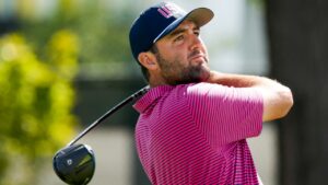 USA teams' Scottie Scheffler hits from the third tee against the International team during a Presidents Cup golf tournament final round singles match at Medinah Country Club, Sunday, Sept. 27, 2026, in Medinah, Ill. (AP Photo/Chris Carlson)