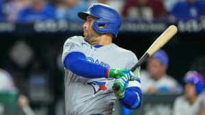 Toronto Blue Jays' George Springer watches his two-run double during the sixth inning of a baseball game against the Kansas City Royals, Friday, Sept. 4, 2026, in Kansas City, Mo. (Charlie Riedel/AP)