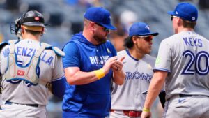 Toronto Blue Jays manager John Schneider stands with players on the mound during a pitching change in the fifth inning of a baseball game against the Kansas City Royals, Sunday, Sept. 6, 2026, in Kansas City, Mo. (Charlie Riedel/AP)