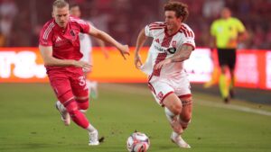 Toronto FC's Josh Sargent, right, brings the ball down the pitch as St. Louis City's Timo Baumgartl defends during the first half of an MLS soccer match Saturday, Sept. 19, 2026, in St. Louis. (AP Photo/Jeff Roberson)