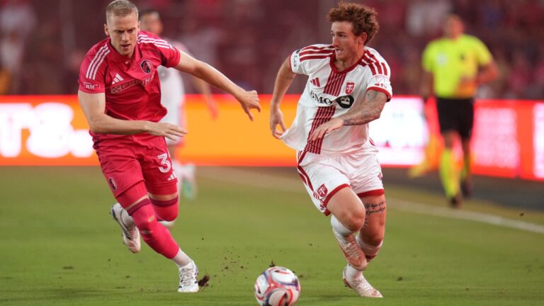 Toronto FC's Josh Sargent, right, brings the ball down the pitch as St. Louis City's Timo Baumgartl defends during the first half of an MLS soccer match Saturday, Sept. 19, 2026, in St. Louis. (AP Photo/Jeff Roberson)