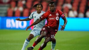 Toronto FC's Richie Laryea (front) battles for the ball with Chicago Fire FC's Puso Dithejane (12) during first half MLS soccer action in Toronto, on Saturday, Sept. 5, 2026. (Keito Newman/CP)