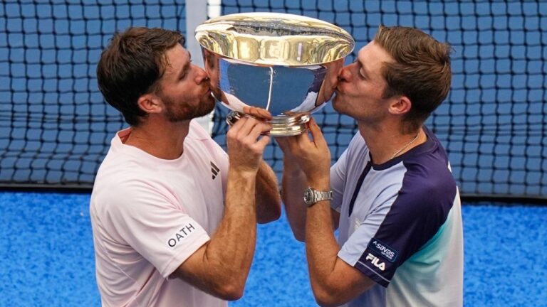 Christian Harrison, of the United States, left, and Neal Skupski, of Britain, right, pose for a photo with their trophy after winning the men's doubles final of the U.S. Open tennis championships against Kevin Krawietz, of Germany, and Tim Puetz, of Germany, Saturday, Sept. 12, 2026, in New York. (Frank Franklin II/AP)