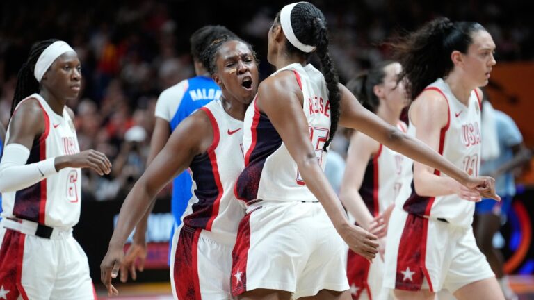 Chelsea Gray, of the United States, left, and Angel Reese react during the Women's Basketball World Cup final match between the United States and France in Berlin, Sunday, Sept. 13, 2026. (AP Photo/Ebrahim Noroozi)