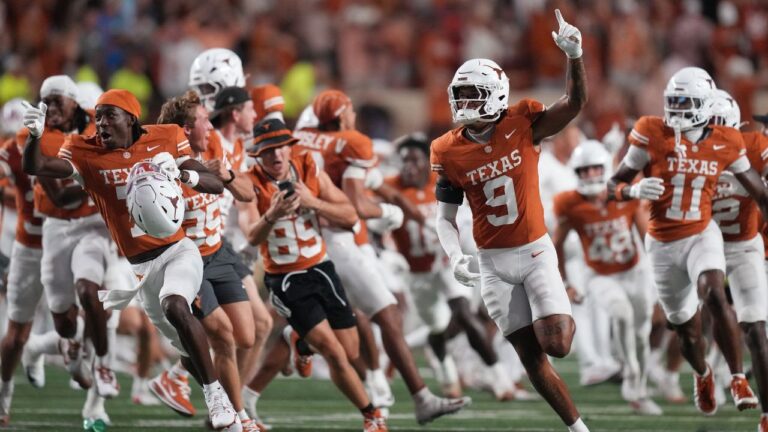 Texas players celebrate their win over Ohio State in an NCAA college football game in Austin, Texas, Saturday, Sept. 12, 2026. (AP Photo/Eric Gay)