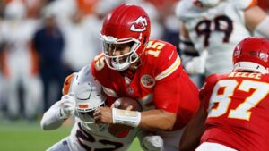 Kansas City Chiefs quarterback Patrick Mahomes dives in the end zone for a touchdown against the Denver Broncos during the first half of an NFL football game Monday, Sept. 14, 2026, in Kansas City, Mo. (AP Photo/Colin E. Braley)