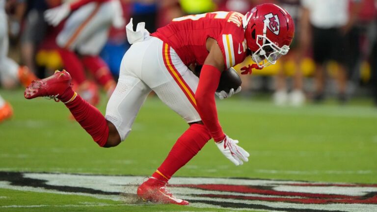 Kansas City Chiefs cornerback Mansoor Delane tries to keep his balance after intercepting a pass by Denver Broncos quarterback Bo Nix during the first half of an NFL football game Monday, Sept. 14, 2026, in Kansas City, Mo. (AP Photo/Charlie Riedel)