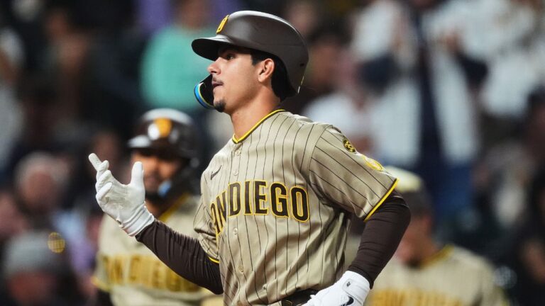San Diego Padres' Ethan Salas gestures as he crosses home plate after hitting a two-run home run off Colorado Rockies relief pitcher Nick Frasso in the fifth inning of a baseball game Wednesday, Sept. 16, 2026, in Denver. (AP Photo/David Zalubowski)