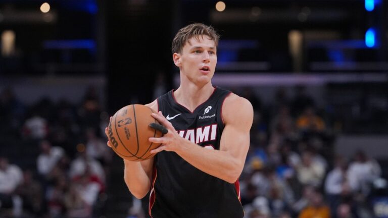 Miami Heat guard Pelle Larsson (9) plays against the Indiana Pacers during the second half of an NBA basketball game in Indianapolis, Sunday, March 29, 2026. (AP Photo/Michael Conroy)