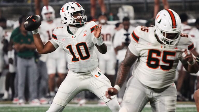 Miami quarterback Darian Mensah (10) looks to pass the ball against Wake Forest during the first half of an NCAA college football game in Winston-Salem, N.C., Friday, Sept. 18, 2026. (AP Photo/Chuck Burton)