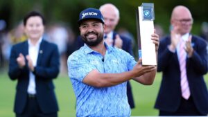 J. J. Spaun of United States lifts the trophy after winning the PGA Championship at Wentworth Golf Club in Virginia Water, England, Sunday Sept. 20, 2026. (Adam Davy/PA via AP)