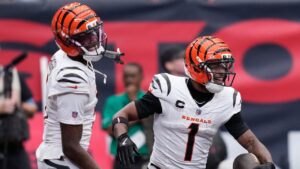 Cincinnati Bengals wide receiver Ja'marr Chase (1), right, and wide receiver Tee Higgins (5), left, celebrate after Chase scored a touchdown during the second second of an NFL football game against the Houston Texans in Houston, Sunday, Sept. 20, 2026. (AP Photo/David J. Phillip)