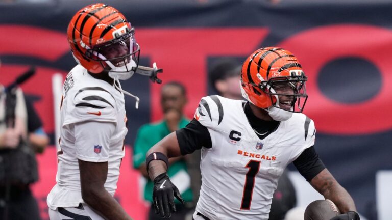 Cincinnati Bengals wide receiver Ja'marr Chase (1), right, and wide receiver Tee Higgins (5), left, celebrate after Chase scored a touchdown during the second second of an NFL football game against the Houston Texans in Houston, Sunday, Sept. 20, 2026. (AP Photo/David J. Phillip)