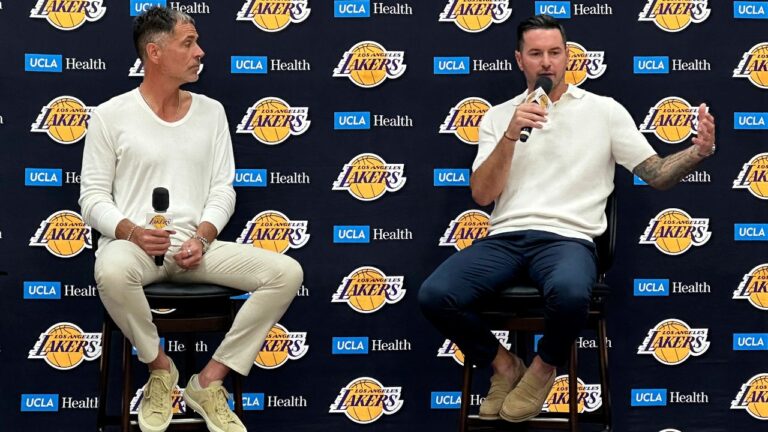 Los Angeles Lakers general manager Rob Pelinka, left and head coach JJ Redick speak with reporters in a news conference at the Lakers' training complex in El Segundo, Calif., on Thursday, Sept. 24, 2026. (AP Photo/Greg Beacham)