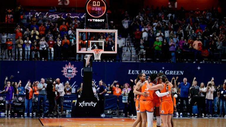 Connecticut Sun players huddle together as the clock runs out at the end of their final WNBA home basketball game, against the Toronto Tempo, Thursday, Sept. 24, 2026, in Uncasville, Conn. (AP Photo/Jessica Hill)