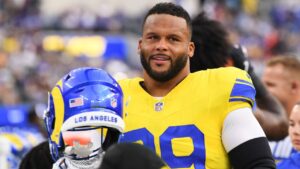 Los Angeles Rams defensive end Aaron Donald looks on from the bench before an NFL football game against the New York Giants in Inglewood, Calif., Monday, Sept. 21, 2026. (AP Photo/Katie Chin)