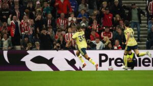 Arsenal's Bruno Guimaraes, center, celebrates after scoring the opening goal during the English Premier League soccer match between Sunderland and Arsenal in Sunderland, England, Saturday, Sept. 12, 2026. (AP Photo/Ian Hodgson)