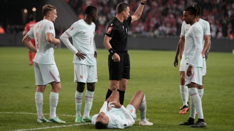 France's Kylian Mbappe lieas on the ground after he scored and injured himself during the UEFA Nations League soccer match between Turkey and France in Izmit, Turkey, Friday, Sept. 25, 2026. (AP Photo/Khalil Hamra)
