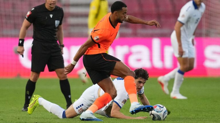 Serbia's Petar Sukacev, on the ground, watches Netherlands' Cody Gakpo control the ball during the Nations League soccer match between Serbia and the Netherlands in Belgrade, Serbia, Sunday, Sept. 27, 2026. (AP Photo/Darko Vojinovic)