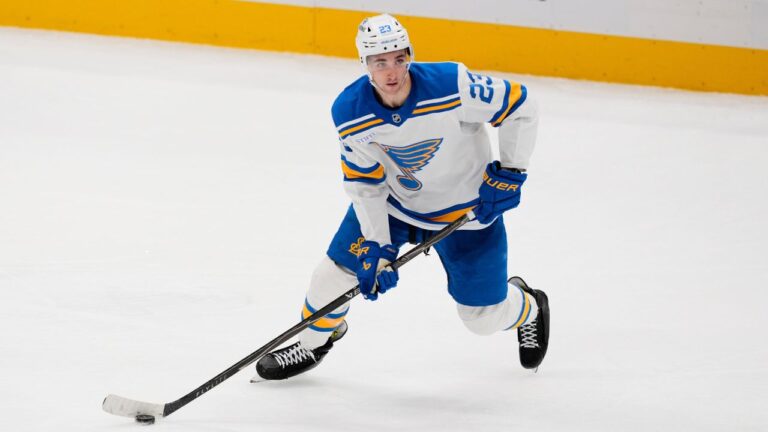 St. Louis Blues defenseman Logan Mailloux handles the puck during an NHL hockey game against the Dallas Stars Wednesday, Feb. 4, 2026, in Dallas. (AP Photo/Tony Gutierrez)