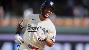 Minnesota Twins' Emmanuel Rodriguez (21) runs the bases after hitting a solo home run for his first-career hit during his MLB debut in the third inning of a baseball game in Minneapolis, Saturday, Sept. 12, 2026. (AP Photo/Abbie Parr)