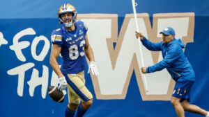 Winnipeg Blue Bombers' Tommy Nield (83) celebrates his touchdown against the Saskatchewan Roughriders during first half CFL football action in Winnipeg, Saturday, Sept. 12, 2026. THE CANADIAN PRESS/John Woods