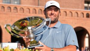 Scottie Scheffler holds the trophy after winning the PGA Tour Championship on Sunday, Aug. 30, 2026, in Atlanta. (Mike Stewart/AP)