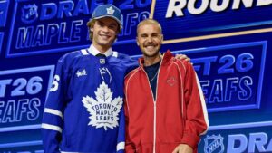 Gavin McKenna, left, stands with singer Justin Bieber after being drafted by the Toronto Maple Leafs during the NHL Draft Friday, June 26, 2026, in Buffalo, N.Y. (Adrian Kraus/AP)