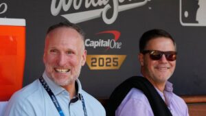 Toronto Blue Jays general manager Ross Atkins, right, and president and CEO Mark Shapiro are seen in the dugout before Game 3 of the World Series against the Los Angeles Dodgers, in Los Angeles, Wednesday, Oct. 27, 2025. (Frank Gunn/CP)