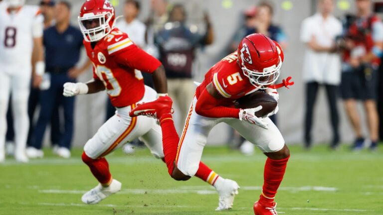 Kansas City Chiefs cornerback Mansoor Delane (5), with teammate cornerback Christian Roland-Wallace (30) looking, intercepts a pass by Denver Broncos quarterback Bo Nix, not visible, during the first half of an NFL football game Monday, Sept. 14, 2026, in Kansas City, Mo. (Colin E. Braley/AP)