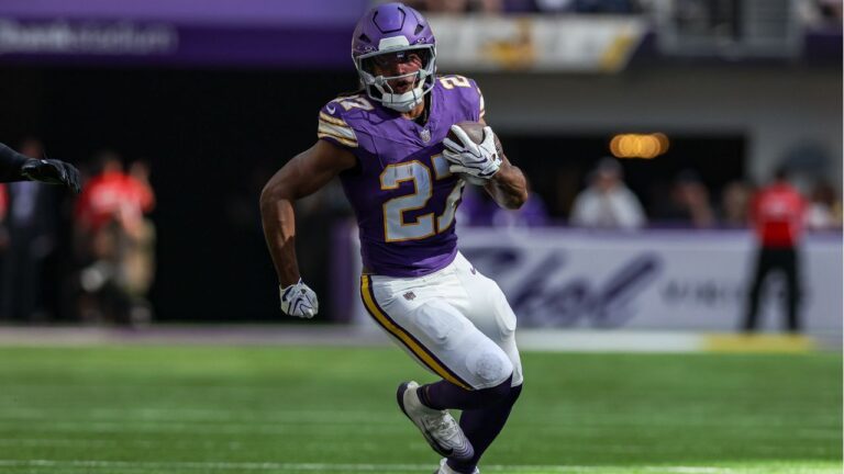 Minnesota Vikings running back Jordan Mason carries the ball during an NFL football game against the Green Bay Packers in Minneapolis, Sunday, Sept. 13, 2026. (Stacy Bengs/AP)