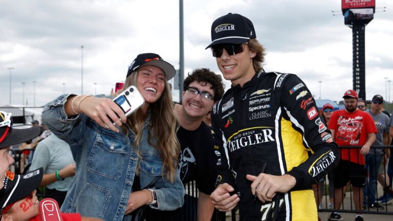 Carson Hocevar, right, interacts with fans before a NASCAR Cup Series race in Kansas City, Kan., Sunday, Sept. 27, 2026. (Colin E. Braley/AP)
